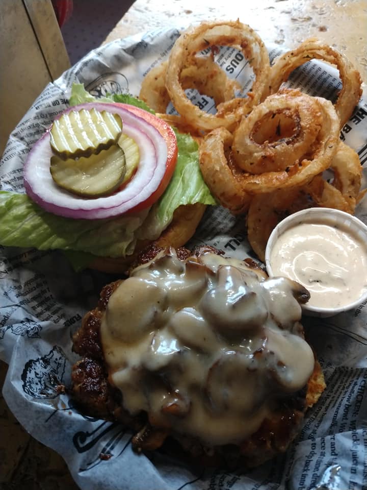 The Falafel Burger — vegetarian house-made patty with tzatziki and spinach